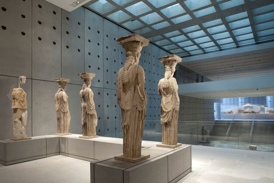 Athens: Early Morning Guided Tour to Acropolis and Museum - Entering the Acropolis from the south slope, with myth tied to place