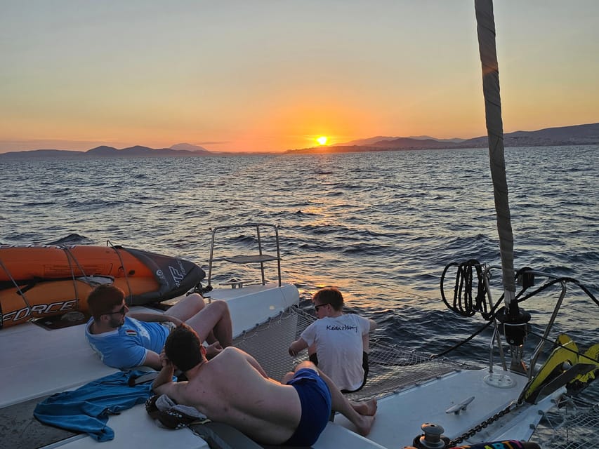 Athens: Riviera Catamaran Tour with Fresh Meal and Drinks - Vouliagmeni stop at Asteras Bay: calm water and sandy simplicity