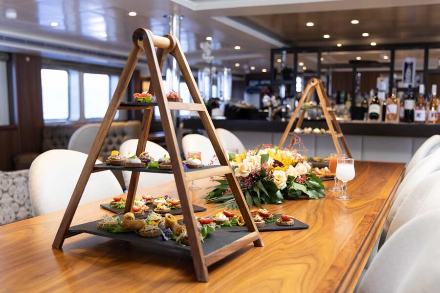 Athens: Saronic Islands Cruise with VIP Area Seating & Lunch - Poros: a calm break with pine trees and shoreline time